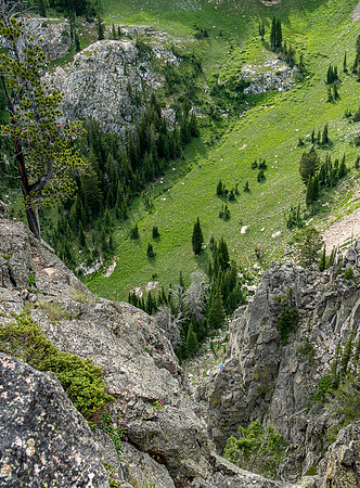 A massive rock buttress, several hundred feet tall on the South boundry of the Jackson Hole Ski resort. (Ryan Chase, a small dot of blue awaits the rest of the climbers)
