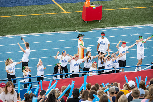 Students gather at the stadium to watch the football championship.