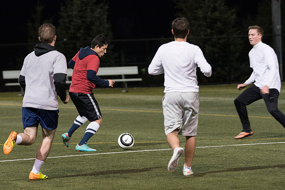Co-Ed Intermediate Soccer teams play game.