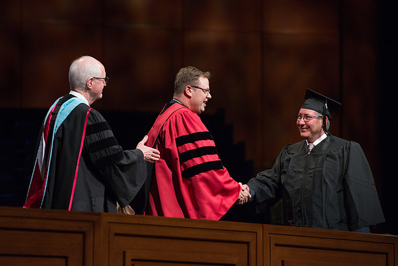 College of Agriculture and Life Sciences Convocation in the Byu-Idaho Center. Elder Wilson and President Clark along with College Dean, John Zenger congratulate the graduates.