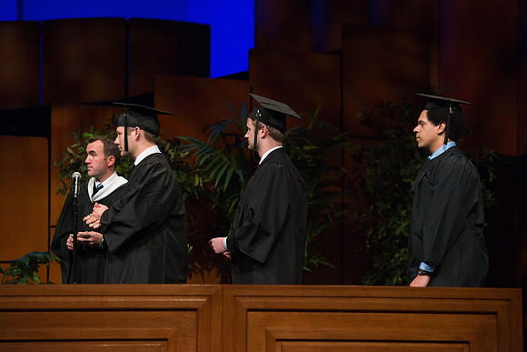College of Agriculture and Life Sciences Convocation in the Byu-Idaho Center. Elder Wilson and President Clark along with College Dean, John Zenger congratulate the graduates.