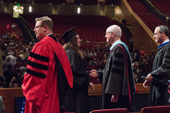College of Agriculture and Life Sciences Convocation in the Byu-Idaho Center. Elder Wilson and President Clark along with College Dean, John Zenger congratulate the graduates.