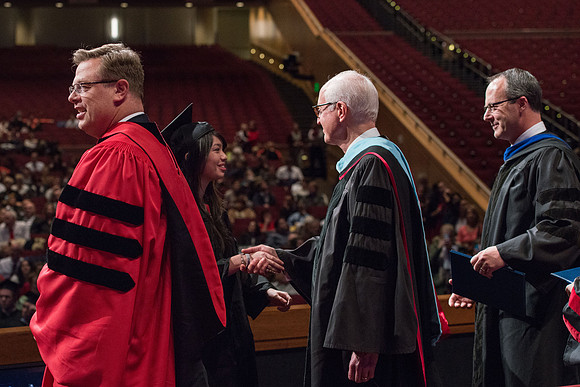 College of Agriculture and Life Sciences Convocation in the Byu-Idaho Center. Elder Wilson and President Clark along with College Dean, John Zenger congratulate the graduates.