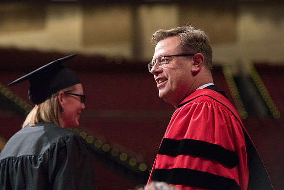 College of Agriculture and Life Sciences Convocation in the Byu-Idaho Center. Elder Wilson and President Clark along with College Dean, John Zenger congratulate the graduates.