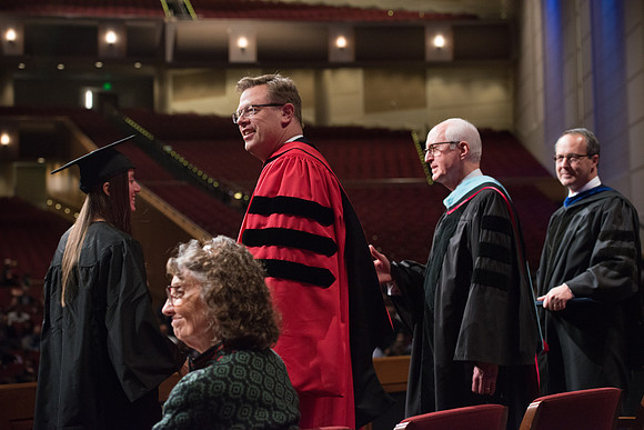 College of Agriculture and Life Sciences Convocation in the Byu-Idaho Center. Elder Wilson and President Clark along with College Dean, John Zenger congratulate the graduates.