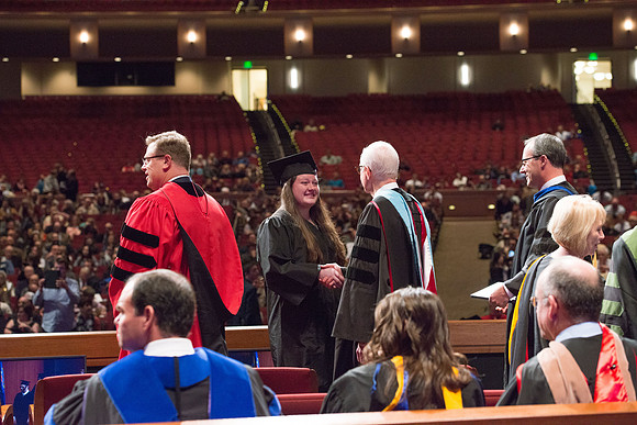 College of Agriculture and Life Sciences Convocation in the Byu-Idaho Center. Elder Wilson and President Clark along with College Dean, John Zenger congratulate the graduates.