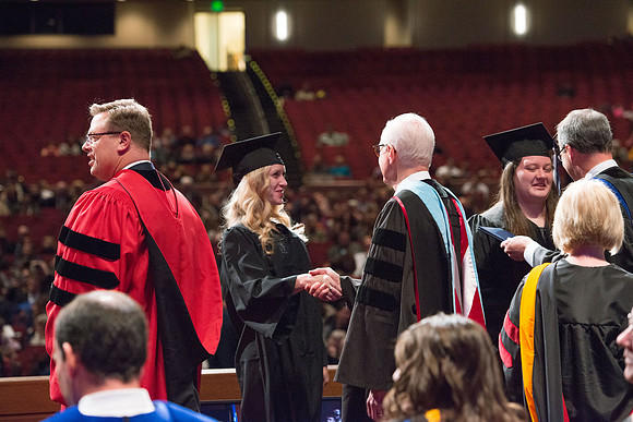 College of Agriculture and Life Sciences Convocation in the Byu-Idaho Center. Elder Wilson and President Clark along with College Dean, John Zenger congratulate the graduates.