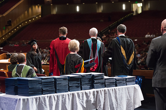 College of Agriculture and Life Sciences Convocation in the Byu-Idaho Center. Elder Wilson and President Clark along with College Dean, John Zenger congratulate the graduates.