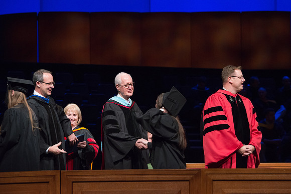 College of Agriculture and Life Sciences Convocation in the Byu-Idaho Center. Elder Wilson and President Clark along with College Dean, John Zenger congratulate the graduates.