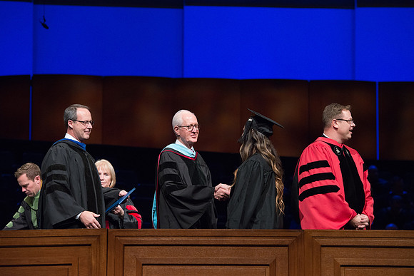 College of Agriculture and Life Sciences Convocation in the Byu-Idaho Center. Elder Wilson and President Clark along with College Dean, John Zenger congratulate the graduates.