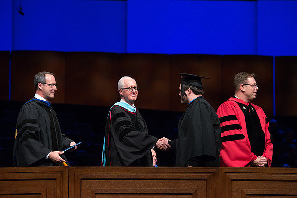 College of Agriculture and Life Sciences Convocation in the Byu-Idaho Center. Elder Wilson and President Clark along with College Dean, John Zenger congratulate the graduates.
