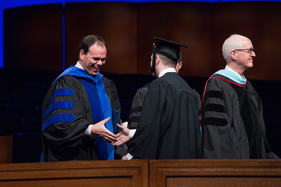 College of Agriculture and Life Sciences Convocation in the Byu-Idaho Center. Elder Wilson and President Clark along with College Dean, John Zenger congratulate the graduates.