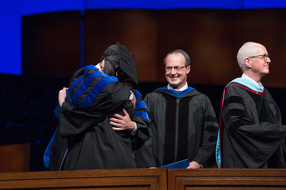 College of Agriculture and Life Sciences Convocation in the Byu-Idaho Center. Elder Wilson and President Clark along with College Dean, John Zenger congratulate the graduates.
