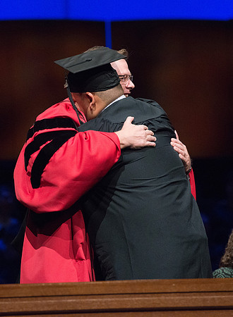 College of Agriculture and Life Sciences Convocation in the Byu-Idaho Center. Elder Wilson and President Clark along with College Dean, John Zenger congratulate the graduates.