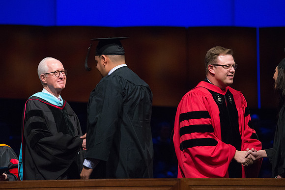 College of Agriculture and Life Sciences Convocation in the Byu-Idaho Center. Elder Wilson and President Clark along with College Dean, John Zenger congratulate the graduates.
