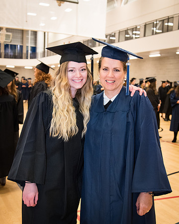 Haley Childers (left) and her mother, Robyn Childers (right), prepare to walk at graduation together. Photo by Emily Gottfredson.