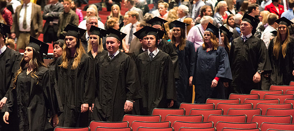 Graduates begin to enter the Commencement ceremony.