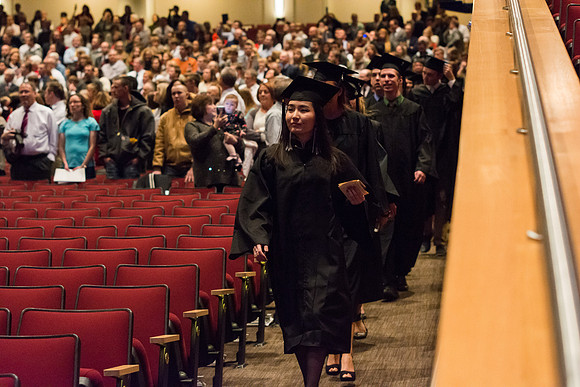 Graduates begin to enter the Commencement ceremony.