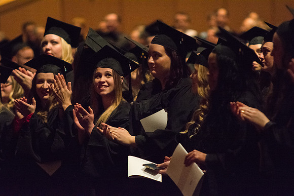 Graduates applaud their family and friends for their support to them.