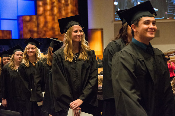 Graduate, Kazia Capener, of Class of 2016, smiles during Recessional.