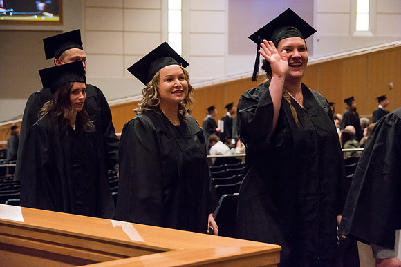 Graduate, Jennifer O'Neil, smiles at her family during Recessional.