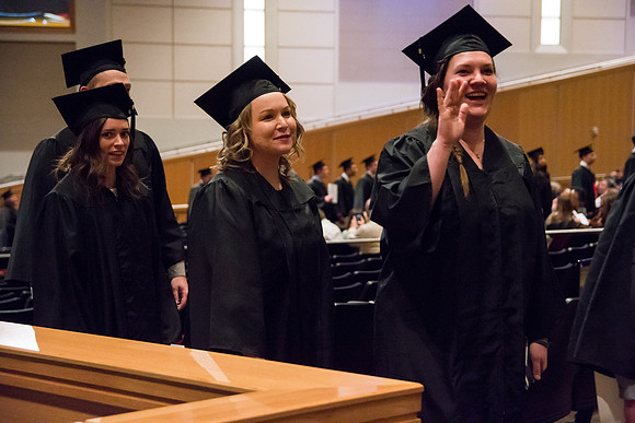 Graduate, Jennifer O'Neil, smiles at her family during Recessional.