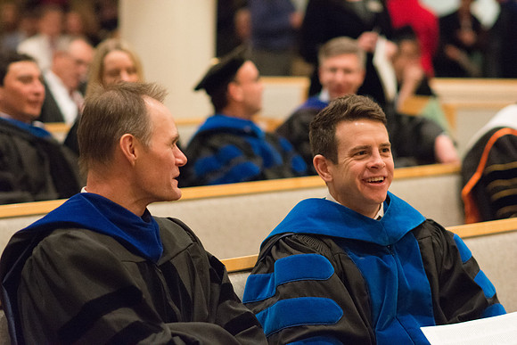Professors wait for Convocation to begin in the Taylor Chapel for the College of Physical Sciences.