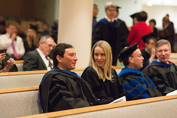 Professors wait for Convocation to begin in the Taylor Chapel for the College of Physical Sciences.