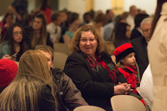 Family members wait for Convocation to begin in the Taylor Chapel for the College of Physical Sciences.