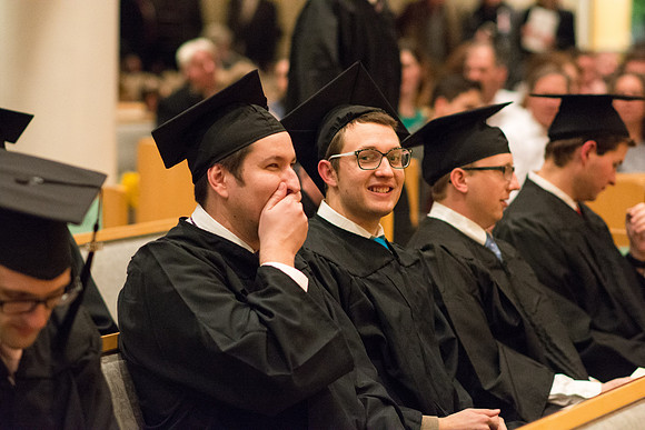 Graduates wait for Convocation to begin in the Taylor Chapel for the College of Physical Sciences.