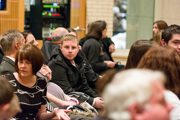Family members wait for Convocation to begin in the Taylor Chapel for the College of Physical Sciences.