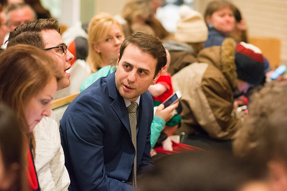 Family members wait for Convocation to begin in the Taylor Chapel for the College of Physical Sciences.