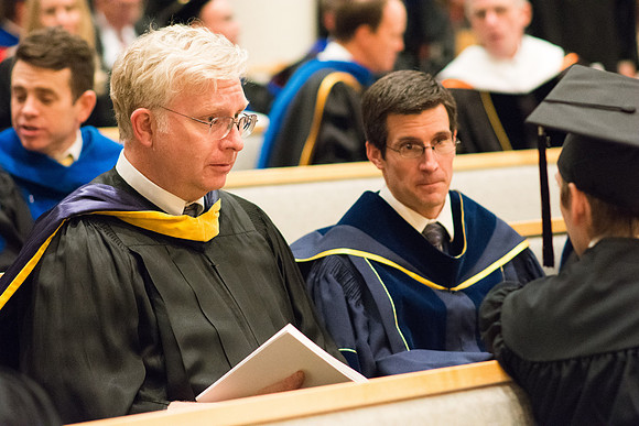 Professors wait for Convocation to begin in the Taylor Chapel for the College of Physical Sciences.
