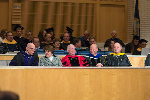 President Henry J. Eyring, Sister Sue Clark and Elder Kim B. Clark wait for Convocation to begin in the Taylor Chapel for the College of Physical Sciences.