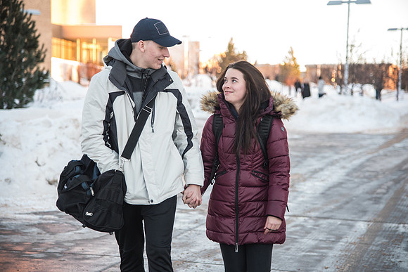 Holding hands for the first time as these two walk home after a long day of classes.