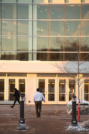 Professor uses the crosswalk to head into the BYU-Idaho Center.