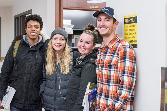 Students return to campus in the frigid cold temperatures.