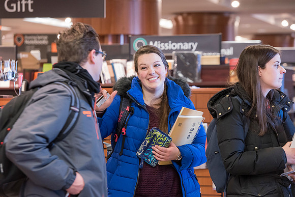 Students return to campus in the frigid cold temperatures.