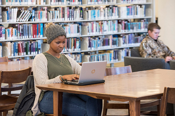 Students return to campus in the frigid cold temperatures.