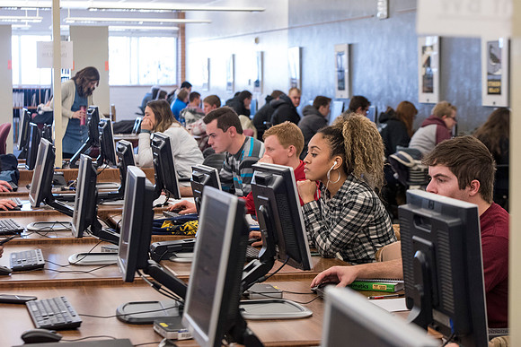 Students return to campus in the frigid cold temperatures.