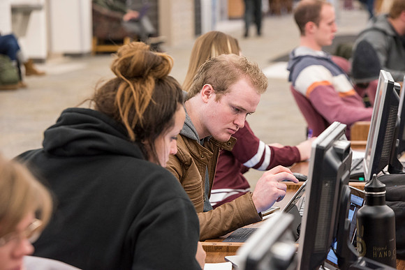 Students return to campus in the frigid cold temperatures.