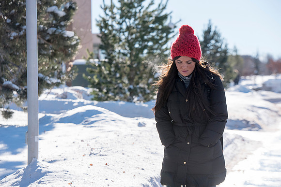 Students return to campus in the frigid cold temperatures.