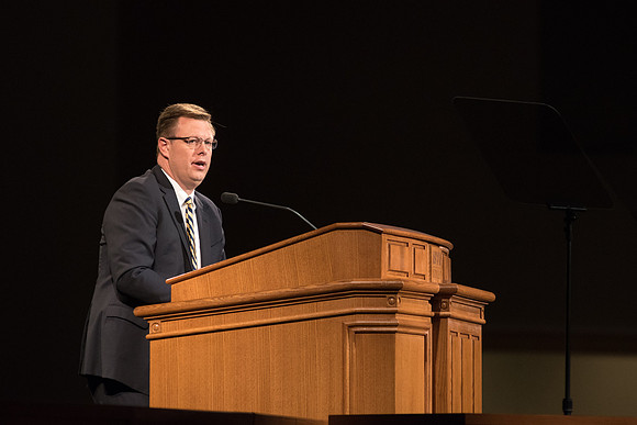 President Gilbert speaks to students during devotional.