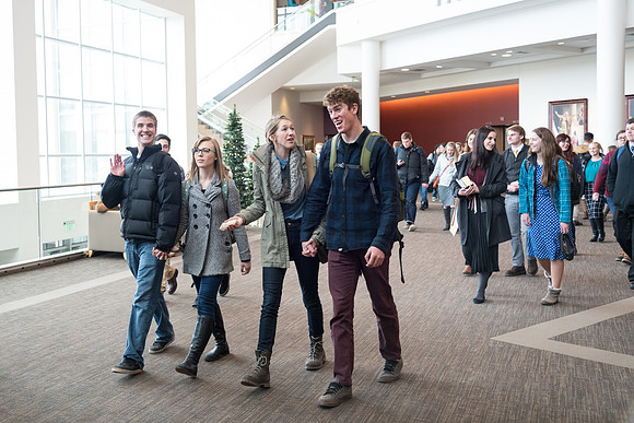 Students leave devotional after listening to President and Sister Gilbert speak.