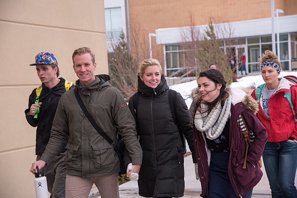Students around campus going to devotional.