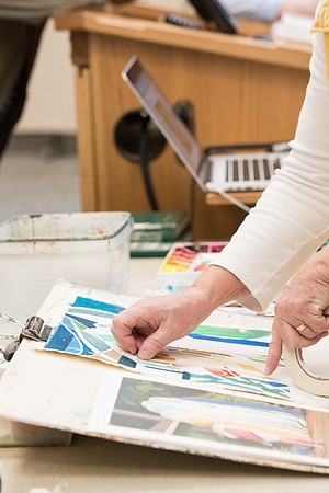 Students work on paintings in Sally Ellis' watercolor class.