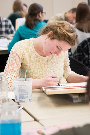 Students work on paintings in Sally Ellis' watercolor class.