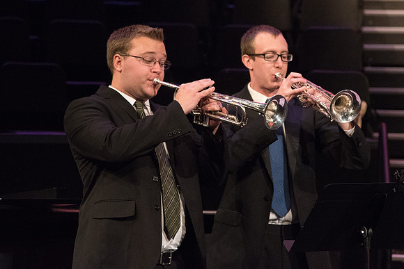 Two young men play trumpets in the Musical Number, The Spirit of God, during Devotional.
