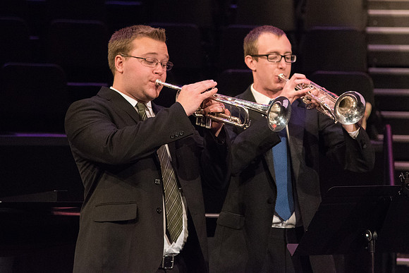 Two young men play trumpets in the Musical Number, The Spirit of God, during Devotional.