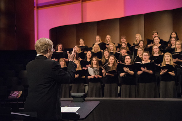 Choir Director, Eda Ashby, leads the BYU-Idaho Choir sings, "The Spirit of God," in Devotional.